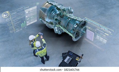 Industry 4.0 Factory: Two Engineers Uses Digital Tablet Computer with Augmented Reality Software Visualize 3D Model of a Jet Turbine Engine. Aircraft Maintenance and Diagnostics. High Angle Shot - Shutterstock ID 1821601766
