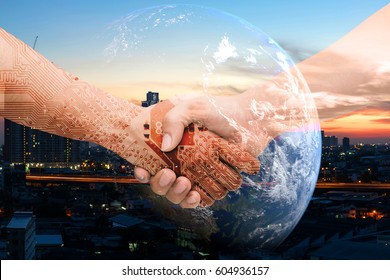 Industry 4.0 internet of things and digital disruption concept. Double exposure of Shaking hands of male people and robot circuit electronic hand with construction building and earth furnished by NASA