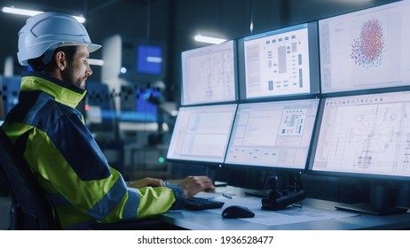 Industry 4.0 Modern Factory: Facility Operator Controls Workshop Production Line, Uses Computer with Screens Showing Complex UI of Machine Operation Processes, Controllers, Machinery Blueprints - Shutterstock ID 1936528477