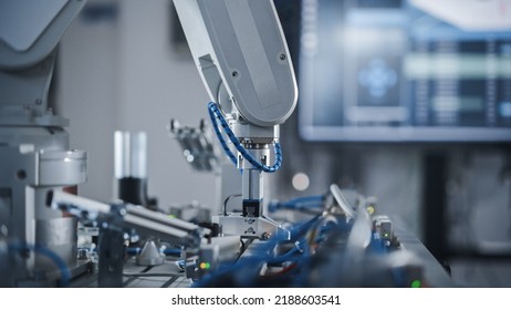 Industry 4.0 Modern Factory: Programmed Robot Arm Moving At Different Sides. Production Line Machine At Empty Room.No People, Close Up View. Automated Robotics Concept