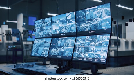 Industry 4.0 Modern Factory: Security Control Room With Multipoke Computer Screens Showing Surveillance Camera Feed. High-Tech Security