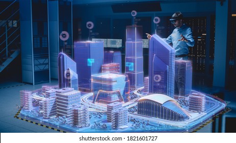 Industry 4.0: Modern Professional Architect Wearing Virtual Reality Headset Uses Gestures to Move, Design, Manipulate Buildings for 3D City. Mixed Augmented Reality Software. VFX Special Visual Effect