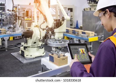 Industry 4.0 Robot concept .Engineers use laptop computers for machine maintenance, automation tools, robot arm at the factory.
 - Shutterstock ID 1018330618