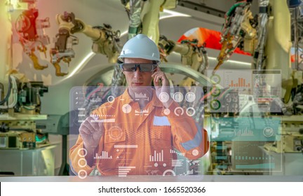 Industry 4.0 Robot Concept .Engineers Are Using Virtual AR To Maintain And Check The Work Of Human Robot In The 4.0 Smart Factory.