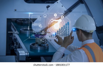 Industry 4.0 Robot Concept .Engineers Are Using Virtual AR To Maintain And Check The Work Of Human Robot In The 4.0 Smart Factory.