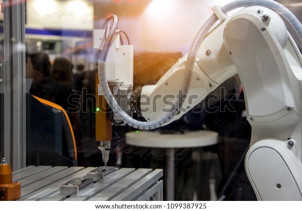 Industry 4.0\
Robot concept .The robot arm is working smartly in the production\
department, the future\
factory.