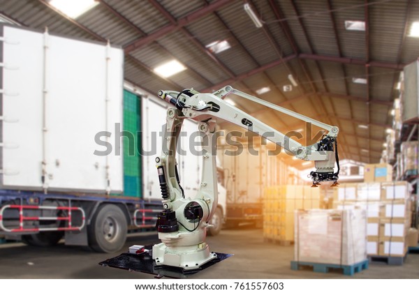 Industry 4.0 Robot concept\
.The robot arm is working smartly in the shipping department of the\
factory.