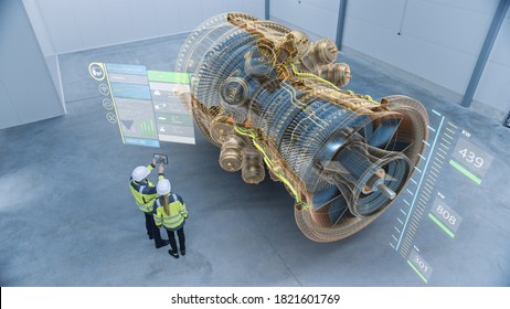 Industry 4.0 Two Engineers Standing and Talking in Factory Workshop with Augmented Reality 3D Model Concept of Giant Turbine Engine. Graphics Visualization. High Angle Shot. VFX Special Visual Effects