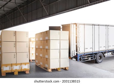 Industry Cargo Freight Trucks Transport Logistics. Shipping Cargo Container Trucks Parked Loading Packagin Boxes at Dock Warehouse. Supply Chain. Distribution Warehouse Center. Shipment Boxes.
