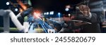 Industry engineer in factory using digital tablet with automated robot arm machine learning operation, system control monitoring, business and smart industry 4.0 technology, AI Artificial intelligence