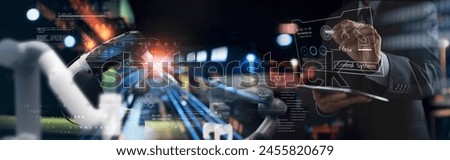 Industry engineer in factory using digital tablet with automated robot arm machine learning operation, system control monitoring, business and smart industry 4.0 technology, AI Artificial intelligence