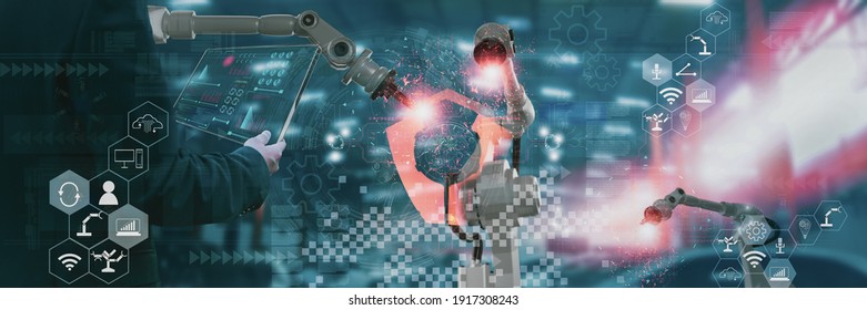 Industry engineer in factory,using smart tablet glass device,control automated robot arm machine learning operation,concept business and industry 4.0,Artificial intelligence or AI,with 5G network