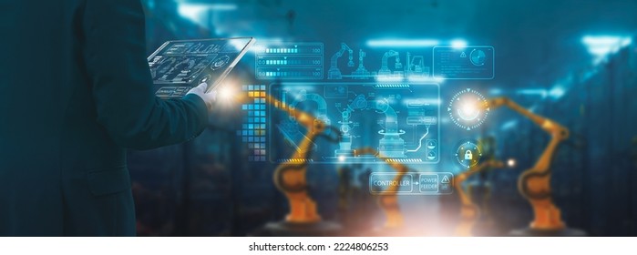 Industry engineer in factory,using smart tablet glass device,control automated robot arm machine learning operation,concept business and industry 4.0,Artificial intelligence or AI,with 5G network