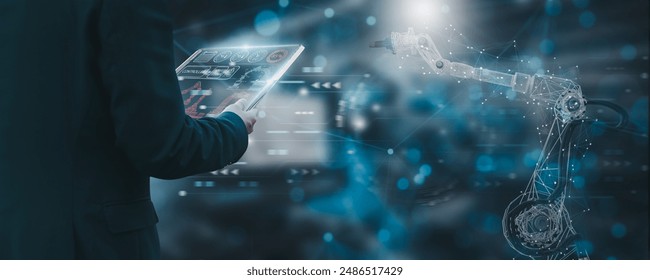 Industry engineer in factory,using smart tablet glass device,control automated robot arm machine learning operation,concept business and industry 4.0,Artificial intelligence or AI,with 5G network - Powered by Shutterstock