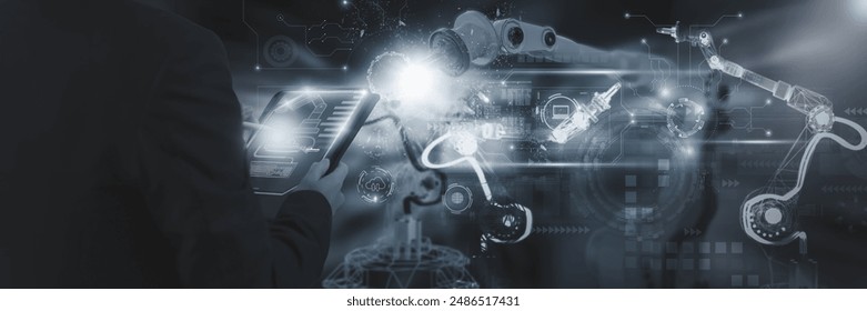 Industry engineer in factory,using smart tablet glass device,control automated robot arm machine learning operation,concept business and industry 4.0,Artificial intelligence or AI,with 5G network