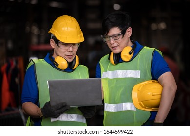 Industry engineer under inspection and checking production process on factory station by laptop,Engineer wearing casual uniform and safety helmet in work. - Shutterstock ID 1644599422