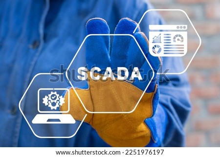 Industry engineer using virtual touchscreen presses acronym: SCADA. SCADA - Supervisory Control And Data Acquisition Technology Industry Concept.