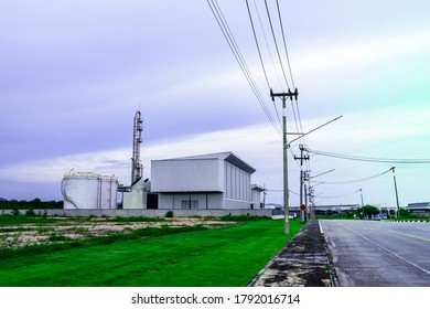 Industry Factory Buidling With Modern Warehouse In Blue Sky Clouds Background. Environmentally Friendly Manufacturing Plant Of New Technology Production Line