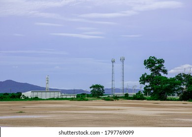 Industry Factory Buidling With Modern Warehouse In Blue Sky Clouds Background. Environmentally Friendly Manufacturing Plant Of New Technology Production Line