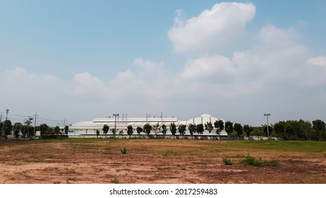 Industry Factory Buidling With Modern Warehouse In Blue Sky Clouds Background. Environmentally Friendly Manufacturing Plant Of New Technology Production Line