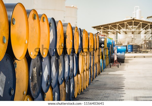 Industry oil barrels or chemical drums\
stacked up. Oil Barrels.Stack Of Oil barrels in\
plant.