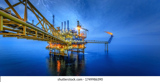 Industry of oil offshore jack up rig at gulf in the time after sunset.