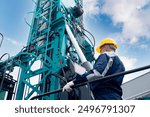 Industry operator use computer tablet for control drilling rig offshore. Technology in industrial exploration oil, minerals, gas and artisan water.