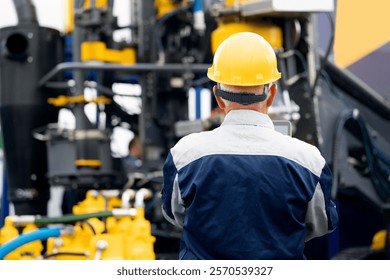 Industry operator use computer tablet for control drilling rig offshore. Technology in industrial exploration oil, minerals, gas and artisan water.