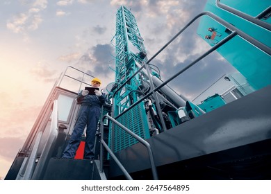 Industry operator use computer tablet for control rig platform for drilling wells for installing explosives on open pit mine coal, mineral, marble.
