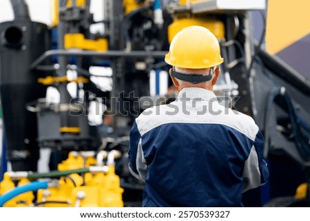 Industry operator use computer tablet for control drilling rig offshore. Technology in industrial exploration oil, minerals, gas and artisan water.