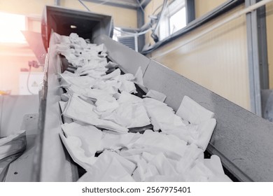 Industry Plant for sorting and processing plastic and paper waste. Conveyor assembly line with garbage bottles and packaging.