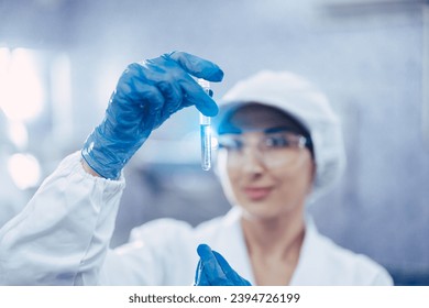 Industry scientist qc staff work checking testing quality of products water in drinking water plant production line. - Powered by Shutterstock