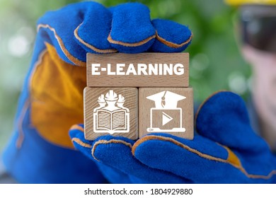 Industry Worker Or Builder Holding Wooden Blocks With E-learning Concept. Electronic Learning Industrial Technology.