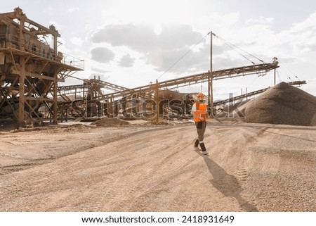 Industry worker engineer work on sand quarry open pit mine. Machine for stone crusher, belt conveyor.