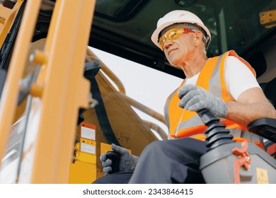 Industry worker portrait. Man driver builder operate crane or excavator at construction site. - Powered by Shutterstock