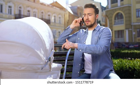 Inexperienced Father Talking Phone Swinging Crying Baby Stroller, Asking Advice