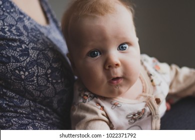 Infant Baby Little Kid Looks Camera Surprised At Mothers Hands Child Innocent Eyes Cheeks. Emotional Baby Boy Scared Look. Happy Parenting Parenthood Love Unity Childhood Lonely Child Abuse Protection