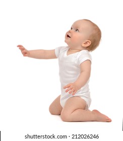 Infant Baby Toddler Sitting Hand Pointing And Looking Up Isolated On A White Background