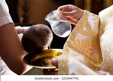 Infant Baptism.
Water Is Poured On The Head Of An Infant.