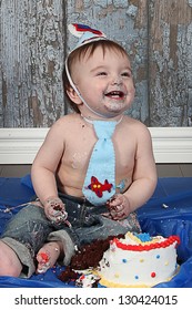 Infant boy's first birthday cake smash Adorable baby smashing cake
