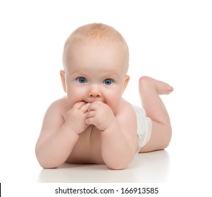 Infant Child Baby Girl In Diaper Lying Happy Smiling And Eating Hands On A White Background