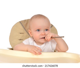 Infant Child Baby Girl Eating Spoon Closeup Isolated On A White Background