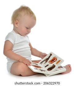 Infant Child Baby Girl Toddler Sitting And Reading Book On A White Background