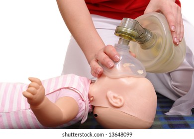 Infant dummy first aid demonstration series - first aid instructor demonstrating artificial respiration using respirator on infant phantom