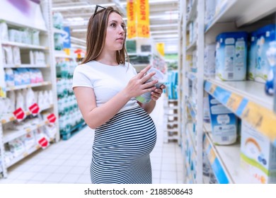 Infant Formula Woman Shopping. Young Pregnant Woman Buying Infant Baby Formula Milk On Supermarket Background. Healthy Baby Formula Concept