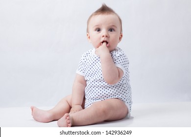 Infant With Hand In Mouth