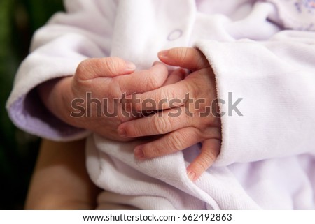Similar – Image, Stock Photo Hands of dad, brother and little newborn.