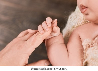 Infant Holding Female Finger. Arm Of A Baby. Grasp Reflex Definition.