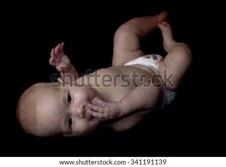 Similar – Baby girl four months old having her bath