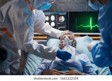 Infected patient in quarantine lying in bed in hospital, coronavirus concept. - Shutterstock ID 1661222104